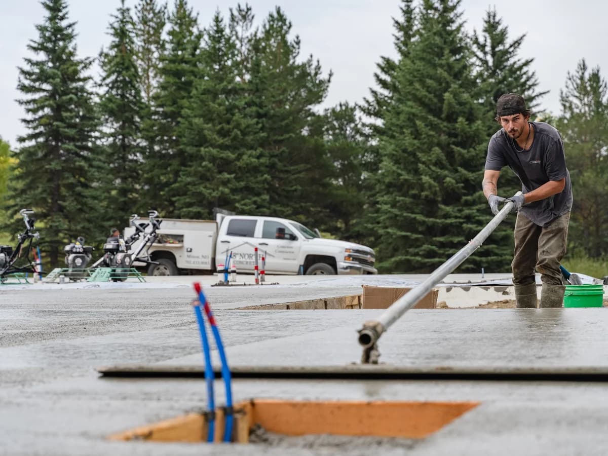 48 North Concrete crew member finishing a slab
